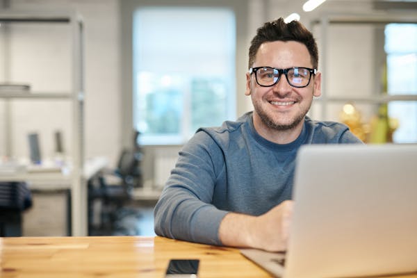 University staff member at their desk